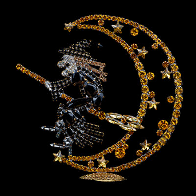 Rhinestone witch flying on a broomstick, sitting on a crescent moon.