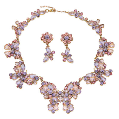 Necklace and earrings featuring butterflies made of pink rhinestones