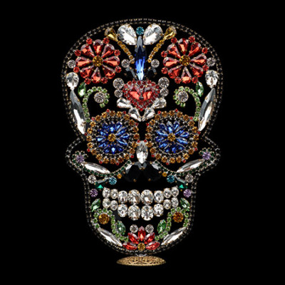 Rhinestone jeweled skull dia de los muertos decor.