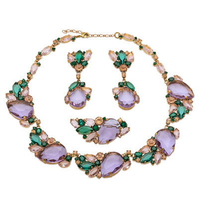 Rhinestone necklace and earrings with leaf and budding flower motif