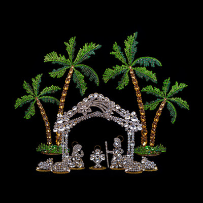 Rhinestones nativity scene with the Holy family, animals and palm trees.