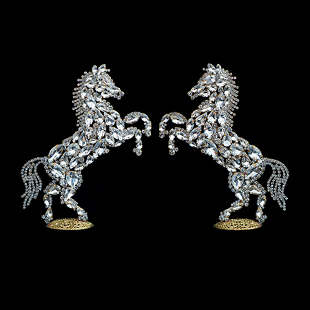Decorative set of two rearing horse figurines made from clear rhinestones.