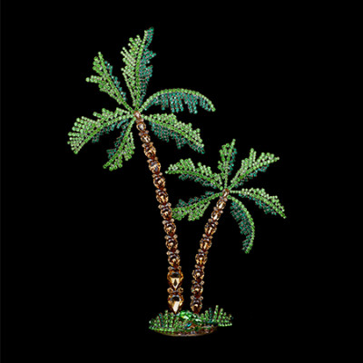 Rhinestone palm trees placed on a grass-like base