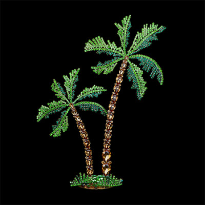 Rhinestone palm trees placed on a grass-like base