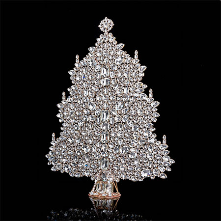 Bountiful Christmas tree, handcrafted with tree decorations.