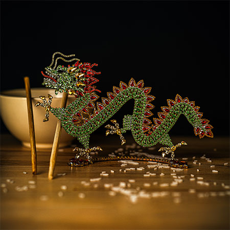 A beautiful Chinese dragon made of rhinestones in red and green.