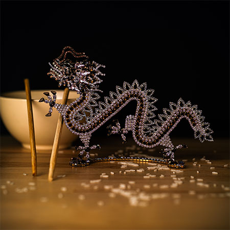 Chinese dragon home decor made from purple rhinestones.