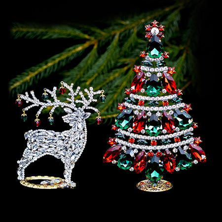 Festive table top vintage Christmas tree and clear reindeer.