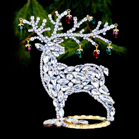 Decorating for Christmas - reindeer with colored rhinestones.