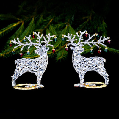 Decorating for Christmas - reindeers with colored rhinestones.