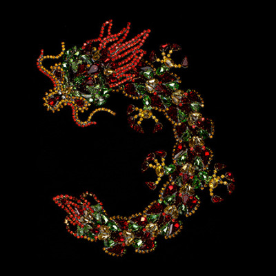 Handmade Chinese dragon brooch from multicolored rhinestones.