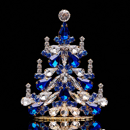 Handcrafted festive Christmas tree with blue rhinestones
