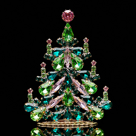 Handcrafted festive Christmas tree with green and pink crystals