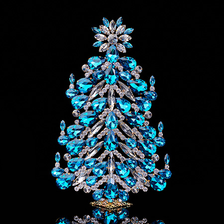 Festive tabletop Christmas tree with aqua rhinestones.