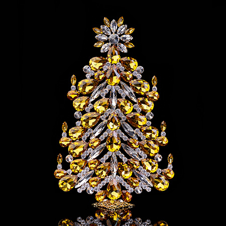 Festive tabletop Christmas tree with yellow rhinestones.