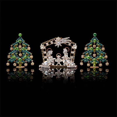 Christmas tree green colored and delicate nativity scene.