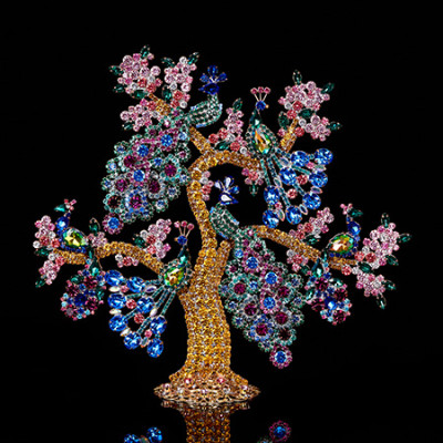 Handcrafted peacock's paradise holiday decoration.