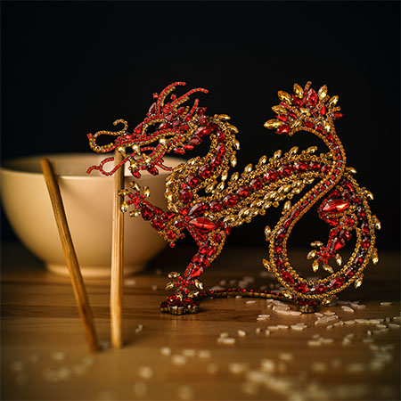 The Chinese dragon decoration from red and gold  rhinestones