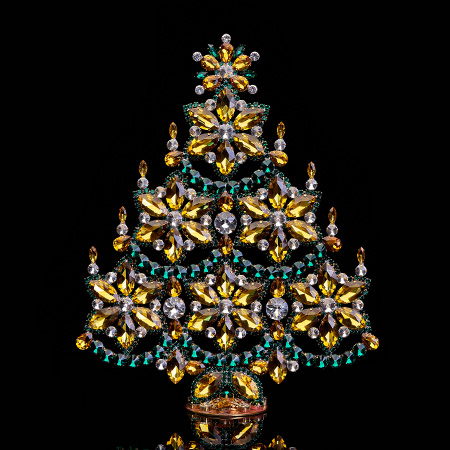 Handmade gold and green Christmas tree with snowflakes and candles