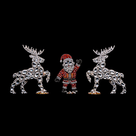 Christmas decoration of Santa Claus and set of valiant reindeers.
